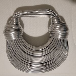 NWOT-Elegant Noodle Rope Silver Clutch